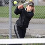 Valen Trujillo shoots a backhand in the first singles match. (Photo by John Fisken)