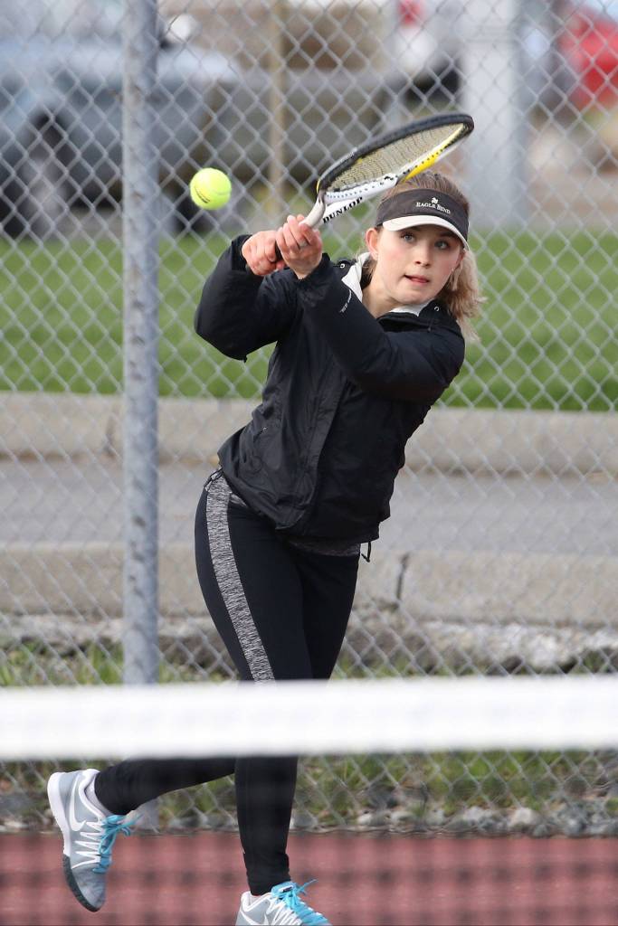 Valen Trujillo shoots a backhand in the first singles match. (Photo by John Fisken)
