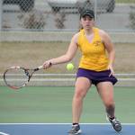 Emma Wezeman smacks a forehand in her first doubles victory with teammate Emily Brown. (Photo by John Fisken)