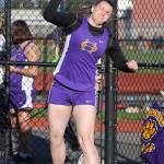 Julie Jansen throws the shot put for the Wildcats. (Photo by John Fisken)