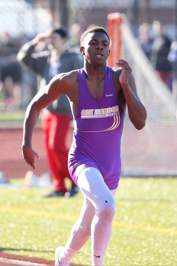 TJ Passmore sprints to the finish line in Thursday&rsquo;s meet. (Photo by John Fisken)