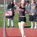 Allison Wenzel flips the discus in Thursday&rsquo;s home meet. (Photo by John Fisken)
