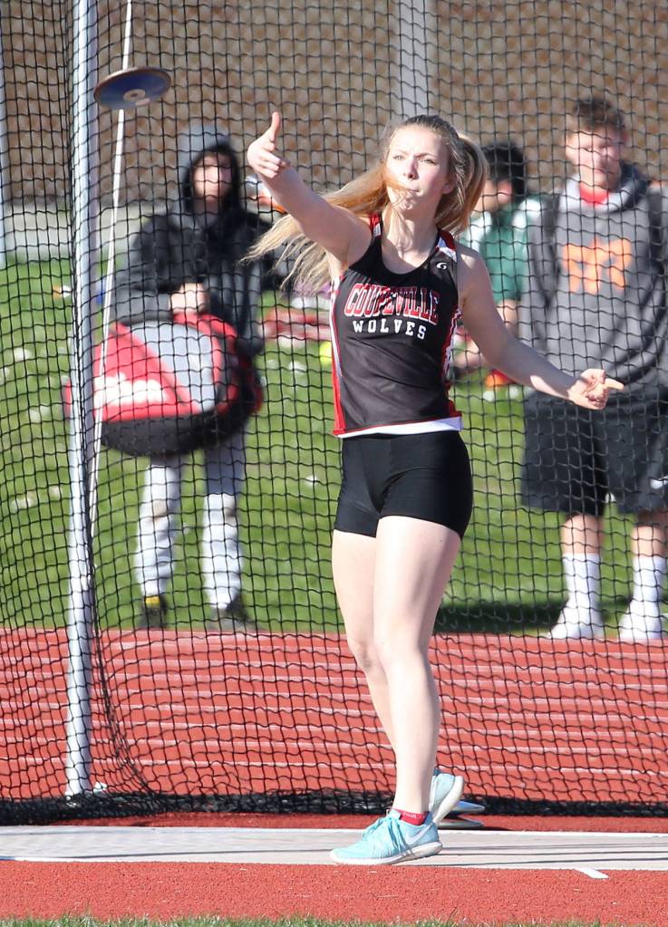 Allison Wenzel flips the discus in Thursday&rsquo;s home meet. (Photo by John Fisken)