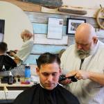 Yondersea owner Kevin Bell gives Petty Officer, 2nd class, Joshua Grant a close cut at his new downtown Oak Harbor barber shop. Photo by Patricia Guthrie/Whidbey News-Times