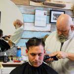 Photos by Patricia Guthrie/Whidbey News-Times                                Petty Officer 2nd Class Joshua Grant gets a close cut known as a fade from barber Kevin Bell recently. Bell specializes in haircuts for men in the military and what he calls &ldquo;rockabilly&rdquo; styles.