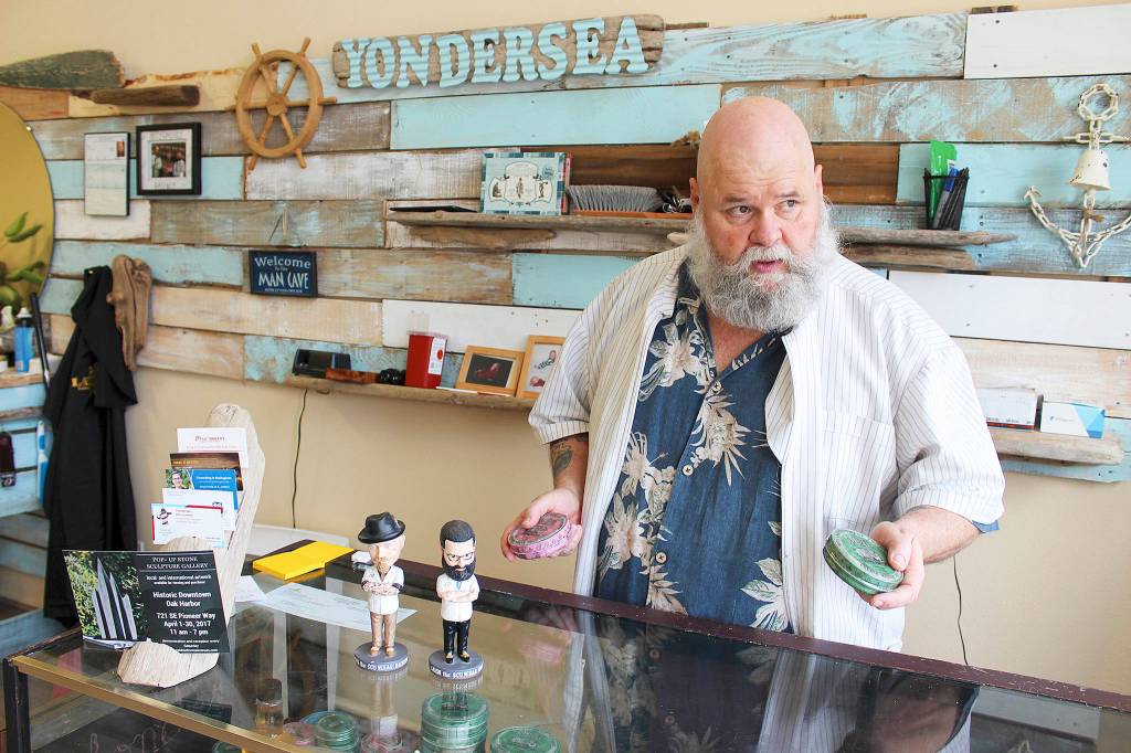 Kevin Bell uses and sells Reuzel, a pomade made for men in Holland, at his Yondersea barber shops.                                Photos by Patricia Guthrie/Whidbey News-Times