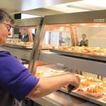 With a food thermometer, Sally Waters checks to make sure both hot and cold foods are kept at proper temperatures. Photos by Patricia Guthrie/Whidbey News-Times