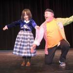 JR Russell, right, presents a prize to Grace Zhao, who gave a special performance before the presentation division got going Sunday at Oak Harbor High School for Whidbey Has Talent. Photo by Daniel Warn/Whidbey News Times