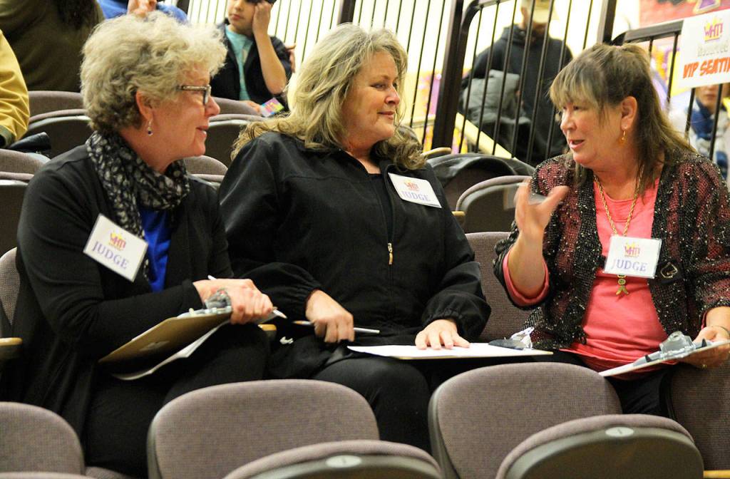 Whidbey Has Talent judges Joy Robbins Pearson, left, Virginia De Long and Daunne Zinger deliberate during the presentation division show Sunday at Oak Harbor High School. Photo by Daniel Warn/Whidbey News-Times
