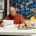 North Whidbey Park and Recreation District Commissioners Richard Fort and Donna Sue Holly review financial comparisons of district programs Thursday. Photo by Megan Hansen/Whidbey News-Times