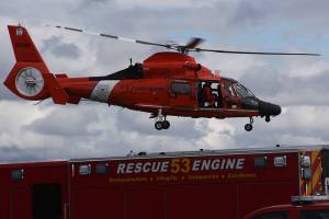 The U.S. Coast Guard helicopter departs from the Keystone Spit portion of Fort Casey State Park after a false alarm involving a diver at the underwater park. A number of other emergency responders arrived as well after someone spotted the diver entering the water in jeans and a sweatshirt and was concerned when he didn&rsquo;t surface. The diver had a wet suit underneath. Photo by Ron Newberry/Whidbey News-Times