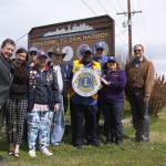 Oak Harbor Mayor Bob Severns, left, and his wife Rhonda Severns are pictured with members of the Oak Harbor Lions Club in front of the south entrance to the city. The club, with Bob Severns&rsquo; help, replaced its emblem on Oak Harbor&rsquo;s welcome sign as part of recognizing Lions Clubs International&rsquo;s centennial anniversary. Photo by Ron Newberry/Whidbey News-Times