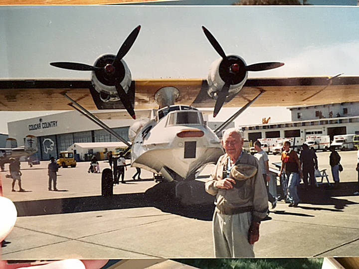 Retired Navy Capt. George Thelen stands next to a PBY at an air show at Ault Field in 2002. Thelen was a PBY pilot during World War II and later one of the first flight instructors at NAS Whidbey. He died in 2006. Photo courtesy Mark Christopher