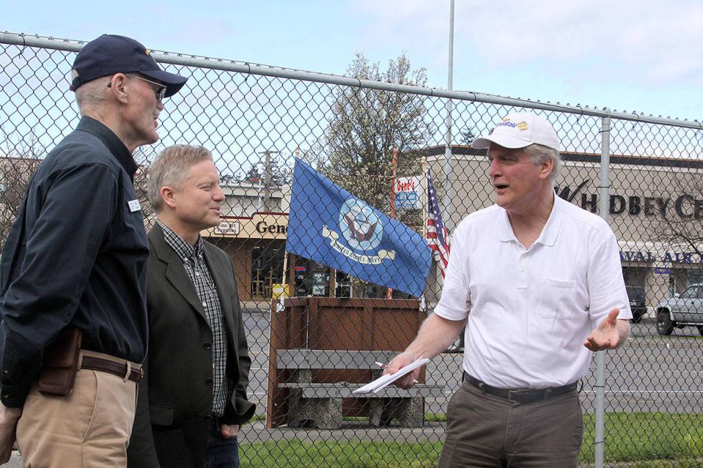 Wil Shellenberger, left, president of the PBY Memorial Foundation, visits with on-air personalities Jim Dever of KING 5&rsquo;s Evening Magazine and Mark Christopher during a tour of the PBY-Naval Air Museum in Oak Harbor Thursday, April 6. Christopher, whose father was a PBY pilot during World War II, will emcee the museum&rsquo;s Celebration of Flight Dinner and Auction Saturday, May 20 at the Oak Harbor Elks Lodge. Dever will serve as the auctioneer. Photo by Ron Newberry/Whidbey News-Times