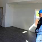 Habitat for Humanity construction supervisor Skeeter Fagan, tours the first floor of a townhouse nearing completion in Oak Harbor near Skagit Valley College.