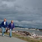 Clouds can&rsquo;t stop walkers from their daily exercise along Oak Harbor&rsquo;s shoreline.                                Photo by Patricia Guthrie/Whidbey News-Times