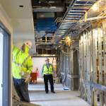 George Senerth (right) WhidbeyHealth executive director of facilities, checks on construction progress of the new addition. Its innovative heating and cooling system is predicted to reduce energy use by half. Photo by Patricia Guthrie/Whidbey News-Times