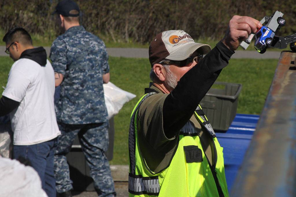 Russ Hawkins, NAS Whidbey Island Recycling Center lead, handles a toy truck during the annual Dumpster Dive competition at Naval Air Station Whidbey Island Friday, April 21, 2007. It was one of a number of base-wide events held in support of Earth Day. Photo by Ron Newberry/Whidbey News-Times