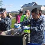 Aviation Support Equipment Technician 2nd Class Tyler Smith, left, examines a loaf of moldy bread during the annual Dumpster Dive competition at NAS Whidbey Friday, April 21, 2017. Photo by Ron Newberry/Whidbey News-Times