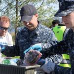 Sailors Jeffrey Rufin, left, Ray Canafax, center, and Tyler Smith represent the Fleet Readiness Center Northwest team during the annual Dumpster Dive competition at Naval Air Station Whidbey Island Friday, April 21, 2017. Photo by Ron Newberry/Whidbey News-Times