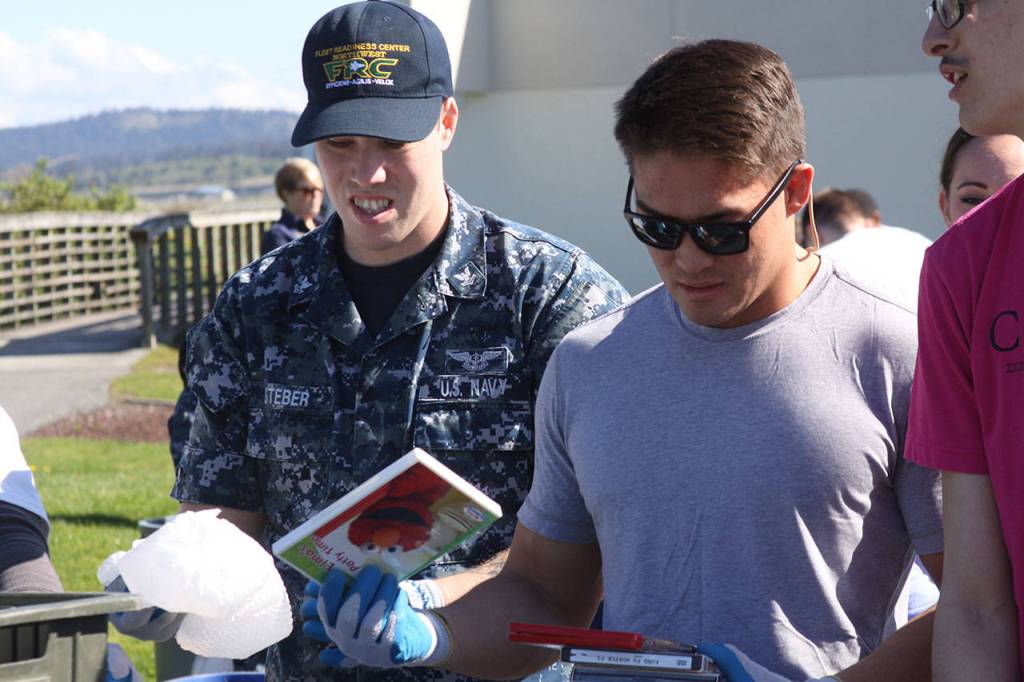 Sailors at Naval Air Station Whidbey Island participate in the annual Dumpster Dive competition as part of numerous Earth Day events at the base Friday, April 21, 2017. There also was a tree planting near the barracks at Ault Field. Photo by Ron Newberry/Whidbey News-Times