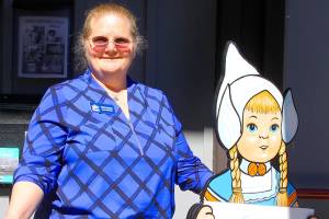 Vicki Graham, events coordinator for Holland Happening, stands next to a Holland Days prop on loan from Lynden at the Oak Harbor Chamber of Commerce conference room Friday. The 48th edition of Holland Happening starts Thursday. Photo by Ron Newberry/Whidbey News-Times