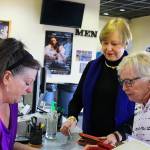 Oak Harbor Cinemas manager Rita LaBelle (left) looks over the Metropolitan Opera schedule with her &ldquo;opera people&rdquo; Clare Christiansen (center) and Carole Lafond before a Saturday performance.Photos by Patricia Guthrie/Whidbey News-Times