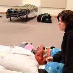 Farrah Lynn gets settled during her first night staying at Oak Harbor&rsquo;s emergency shelter for homeless. She&rsquo;s still recovering from being sick all winter living in a tent. &ldquo;I feel blessed to be here,&rdquo; she said. Photo by Patricia Guthrie/Whidbey News-Times