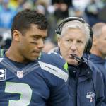 Seahawks quarterback Russell Wilson speaks with coach Pete Carroll about plans to train on Whidbey Island this summer.
