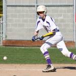 Dyan Bailey puts down a bunt for a base hit. (Photo by John Fisken)