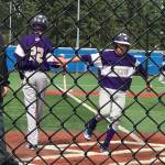 James Besaw is greeted by Joseph Dixon (22) at home plate after scoring on a bases loaded walk to Cory Roberts. (Photo by Teresa Besaw)