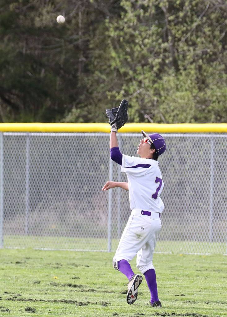 Rightfielder Caleb Fitzgerald runs down a flyball. (Photo by John Fisken)