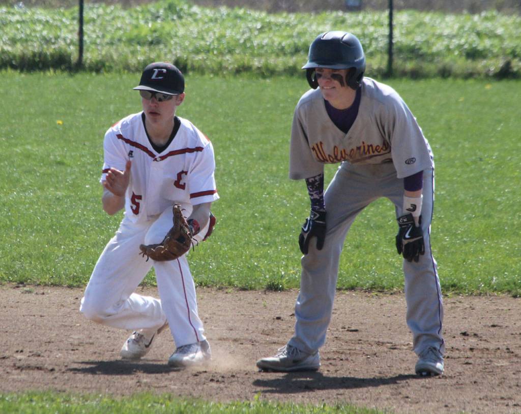 Shortstop Matt Hilborn, left, keeps a Friday Harbor runner close at second. (Photo by Jim Waller/Whidbey News-Times)