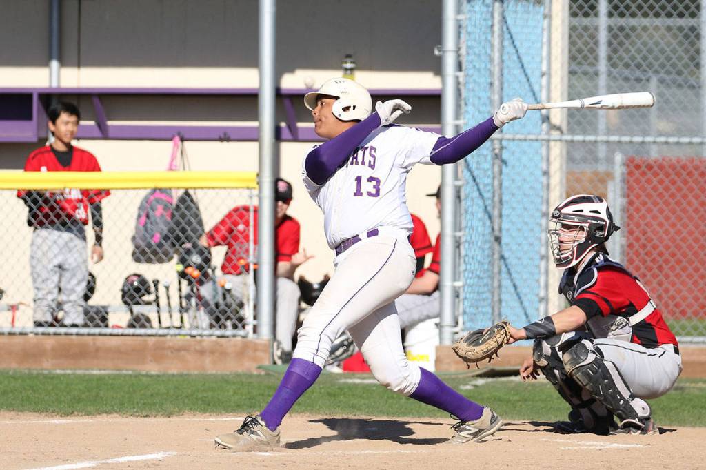 Kamren Mebane slaps a double for the Wildcats. (Photo by John Fisken)