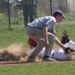 Clay Reilly slides safely into third base. (Photo by Jim Waller/Whidbey News-Times)