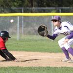 Steven Richards awaits a throw in an attempt to pick off Mountlake Terrace&rsquo;s Jared Maxfield. (Photo by John Fisken)