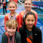 Whidbey Island athletes (clockwise, top left) Heidi Mullins, Lainey Samek, Kaia Crebbin and Allison Lovett competed in the state trampoline and tumpline tournament last weekend. (Photo submitted by Pam Lovett)