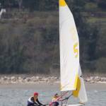Austin Hauser (red cap) and Jenny Danielson race for the Wildcats. (Photo by John Fisken)
