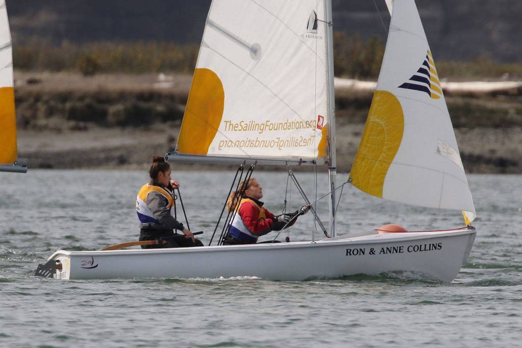 Jordan Wood-Pina, left, and Piper Fisher get ready to sail. (Photo by John Fisken)