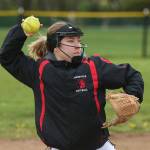 Lauren Rose tosses to first in the LC game. (Photo by John Fisken)