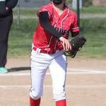 Pitcher Scout Smith tosses to first base for an out. (Photo by John Fisken)
