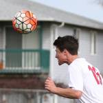 Teo Kelwitz uses his head to advance the ball. (Photo by John Fisken)