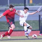 Oak Harbor&rsquo;s Kanoa King, right, battles Stanwood&rsquo;s Arie VanVeen for control. (Photo by John Fisken)