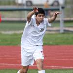 Aram Leyva tosses the ball in for the Wolves. (Photo by John Fisken)