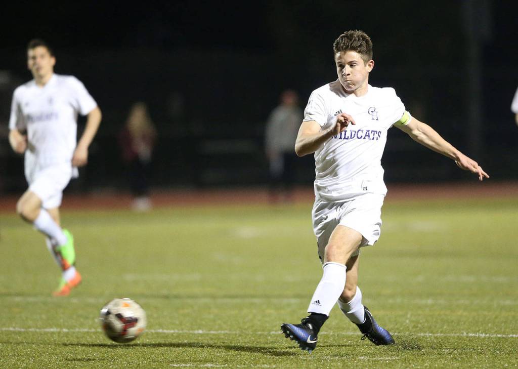 JJ Mitchell, who scored three goals in the match, punches the ball forward. (Photo by John Fisken)