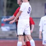 Enrique Perez-Herranz outjumps a Stanwood player to get his head on the ball. (Photo by John Fisken)