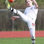 Ethan Spark reaches to boot the ball in Friday&rsquo;s match with Port Townsend. (Photo by John Fisken)