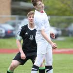 Ethan Spark advances the ball with a header. (Photo by John Fisken)