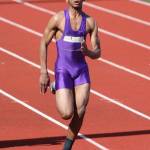 Dorian Hardin runs in the 100 meters for Oak Harbor at Thursday&rsquo;s track meet. (Photo by John Fisken)