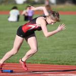 Lauren Grove shoots out of the blocks on the way to winning the 200. (Photo by John Fisken)